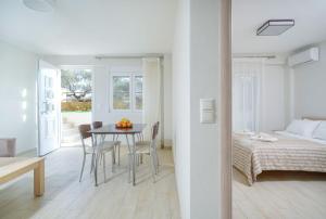 Postel nebo postele na pokoji v ubytování Ilias Apartments