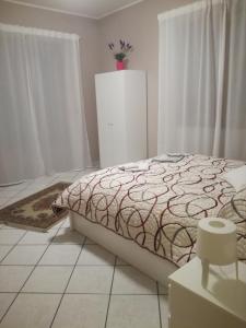 Llit o llits en una habitació de I capricci dell'Etna 2 di Puglisi