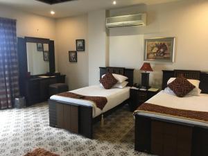 Cama ou camas em um quarto em Marian Hotel