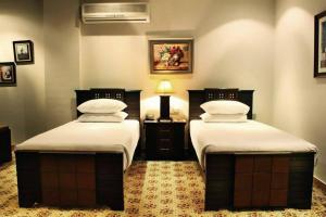 Cama ou camas em um quarto em Marian Hotel