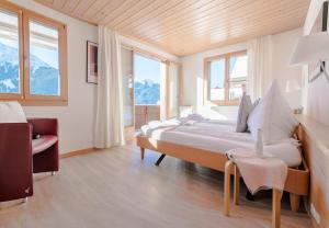 Postel nebo postele na pokoji v ubytování Chalet Millennium