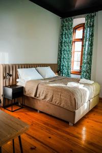 Posteľ alebo postele v izbe v ubytovaní Apartamenty w Wieży