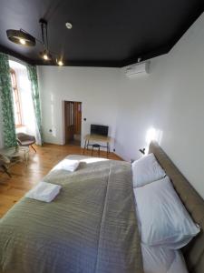 Posteľ alebo postele v izbe v ubytovaní Apartamenty w Wieży