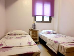 Posteľ alebo postele v izbe v ubytovaní Los Locos Beach Apartments