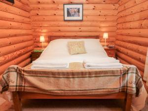 מיטה או מיטות בחדר ב-23 Lakeside Drive