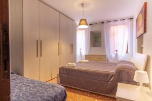 Ein Bett oder Betten in einem Zimmer der Unterkunft Ai tre Archi apartment