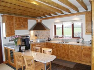 Kuchyň nebo kuchyňský kout v ubytování Cable Cottage