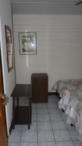 Postel nebo postele na pokoji v ubytování Hotel Arboleda