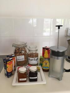 a kitchen counter with jars of food and a blender at Clarevale Cottage B&B in Clare