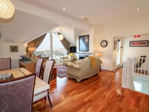 a living room with a table and chairs and a dining room at Seaview in Coleraine