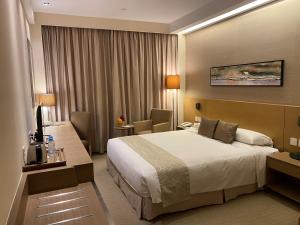 Letto o letti in una camera di The Salisbury - YMCA of Hong Kong