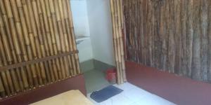 Postel nebo postele na pokoji v ubytování Made Roejas Homestay