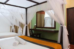 Ліжко або ліжка в номері Xotic Resort