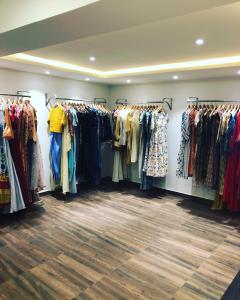a clothing store with many different types of clothes on racks at Sanctum Suites BEL Road Bangalore in Bangalore
