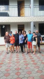 a group of people standing in front of a building at Wanyama B&B in Arusha