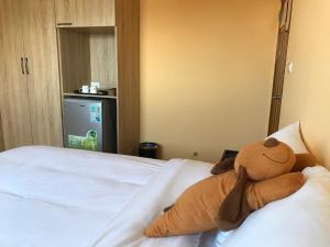Кровать или кровати в номере Ding Dong Homestay