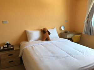 Кровать или кровати в номере Ding Dong Homestay