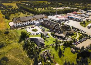 an aerial view of the resort with a large building at Hotel Pajero in Horbów