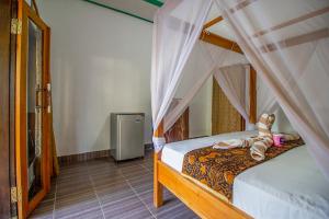 Postel nebo postele na pokoji v ubytování Balengku Homestay