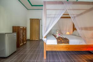 Postel nebo postele na pokoji v ubytování Balengku Homestay