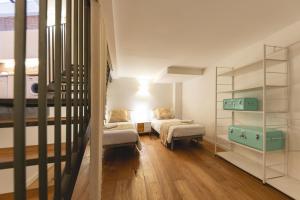 a living room with two couches and a table at Bravissimo Sacsimort in Girona