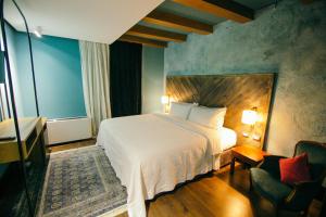 Postel nebo postele na pokoji v ubytování Cathedral Boutique Hotel