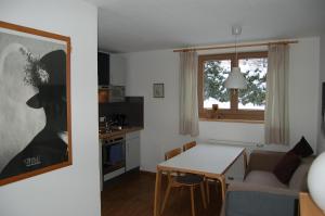 a living room with a couch and a table at Landhaus Neussl in Kaltenbach
