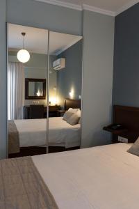 Posteľ alebo postele v izbe v ubytovaní HOTEL HILL