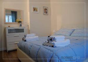 Postel nebo postele na pokoji v ubytování Momentoroma b&b