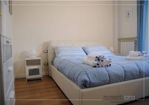 Postel nebo postele na pokoji v ubytování Momentoroma b&b