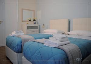 Postel nebo postele na pokoji v ubytování Momentoroma b&b