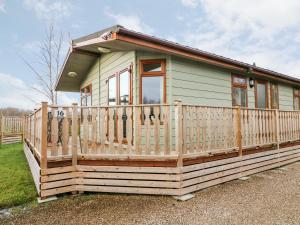a tiny house with a large deck at 16 Sherwood Lodge in Carnforth