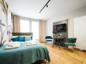Łóżko lub łóżka w pokoju w obiekcie Aparthotel Inspire Miodova Residence
