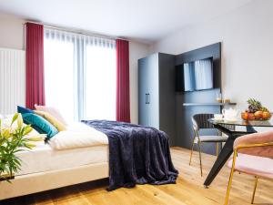 Łóżko lub łóżka w pokoju w obiekcie Aparthotel Inspire Miodova Residence