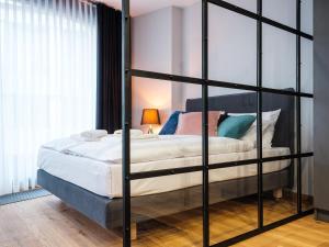 Łóżko lub łóżka w pokoju w obiekcie Aparthotel Inspire Miodova Residence