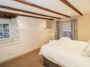 Ένα ή περισσότερα κρεβάτια σε δωμάτιο στο Dovecote +13 φωτογραφίες