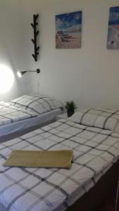 a bedroom with two beds and a lamp at Apartment Luz & Luna in Villajoyosa