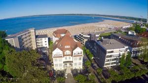 an aerial view of a beach and a building at Hotel Atlantic Travemünde in Travemünde
