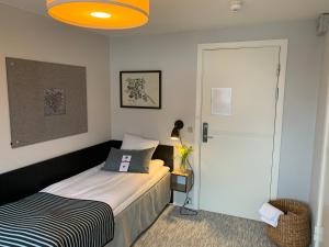 A bed or beds in a room at Rungstedgaard