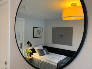 A bed or beds in a room at Rungstedgaard