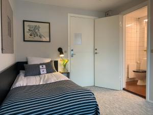 A bed or beds in a room at Rungstedgaard