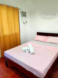 Katil atau katil-katil dalam bilik di Two Season Tourist Inn
