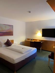 Postel nebo postele na pokoji v ubytování Hotel Schober