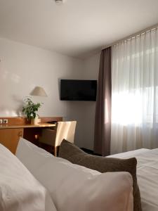 Postel nebo postele na pokoji v ubytování Hotel Schober