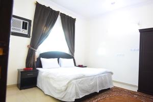 Krevet ili kreveti u jedinici u objektu Al Eairy Apartments - Hail 3
