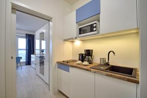 Kuchyňa alebo kuchynka v ubytovaní Apartamenty Onyx SeaView by Rent like home