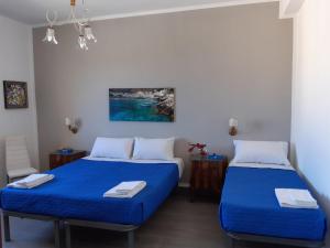 Letto o letti in una camera di Le Quattro Isole