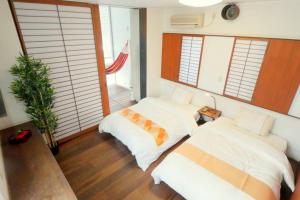 Tempat tidur dalam kamar di 大阪 忍者家 o10