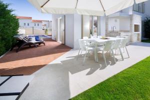 Patio nebo venkovní prostory v ubytování Villa Sylvia by HMZ Villas