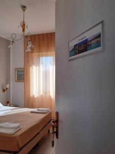 Letto o letti in una camera di Le Quattro Isole